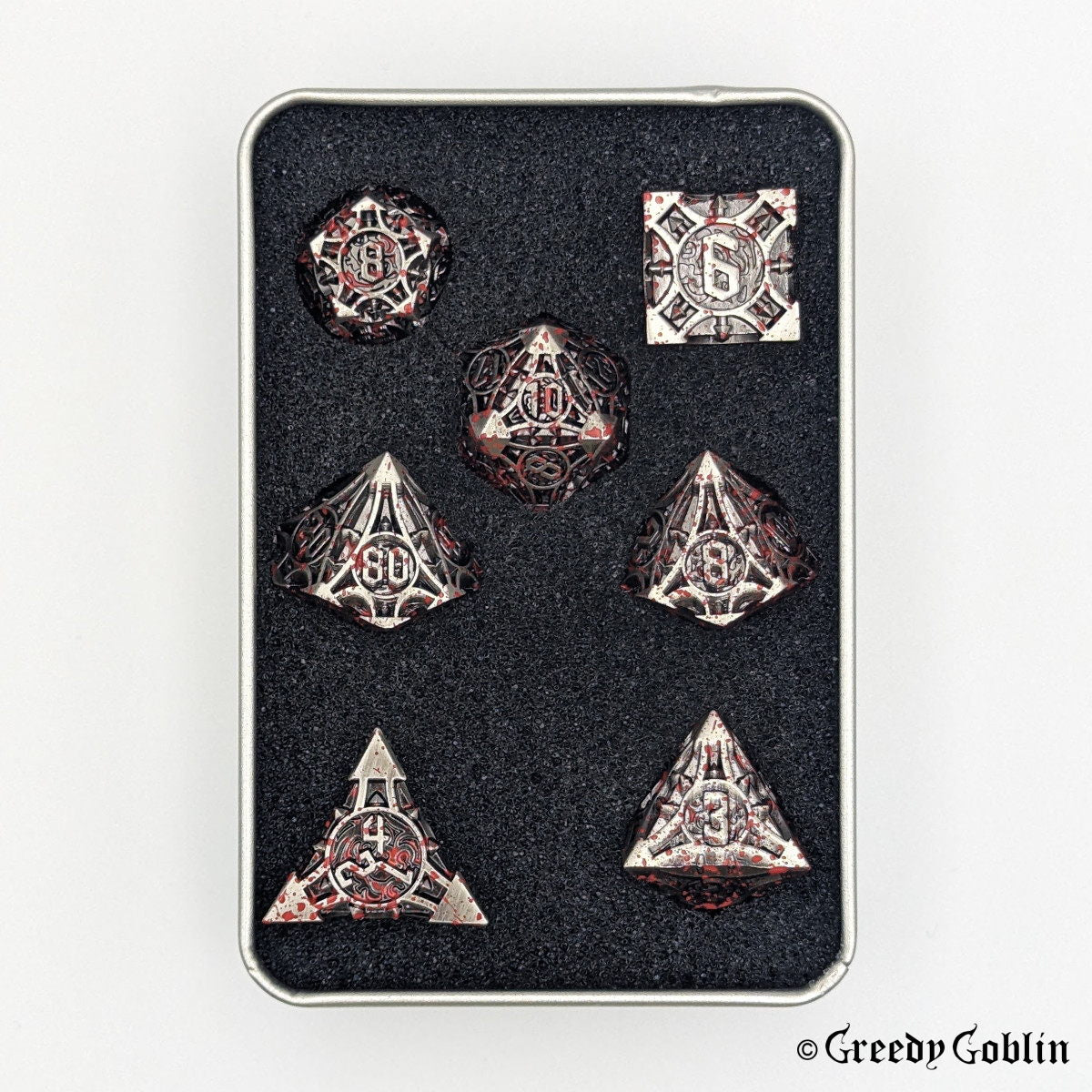 Metal grey Polydice set (D100, D8, D12, D10, D6, D20, D4) in a metal tin box with red splatters.