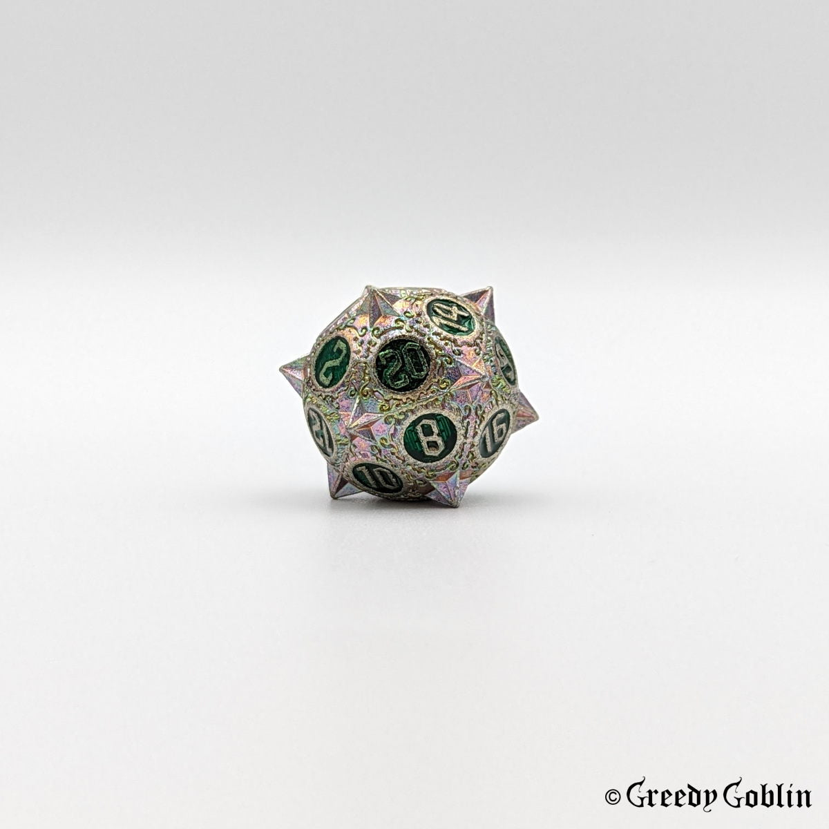 Metal D20 from DnD dice set with sharp edges and oil-slick finish. The engravings behind the numbers are dark green.