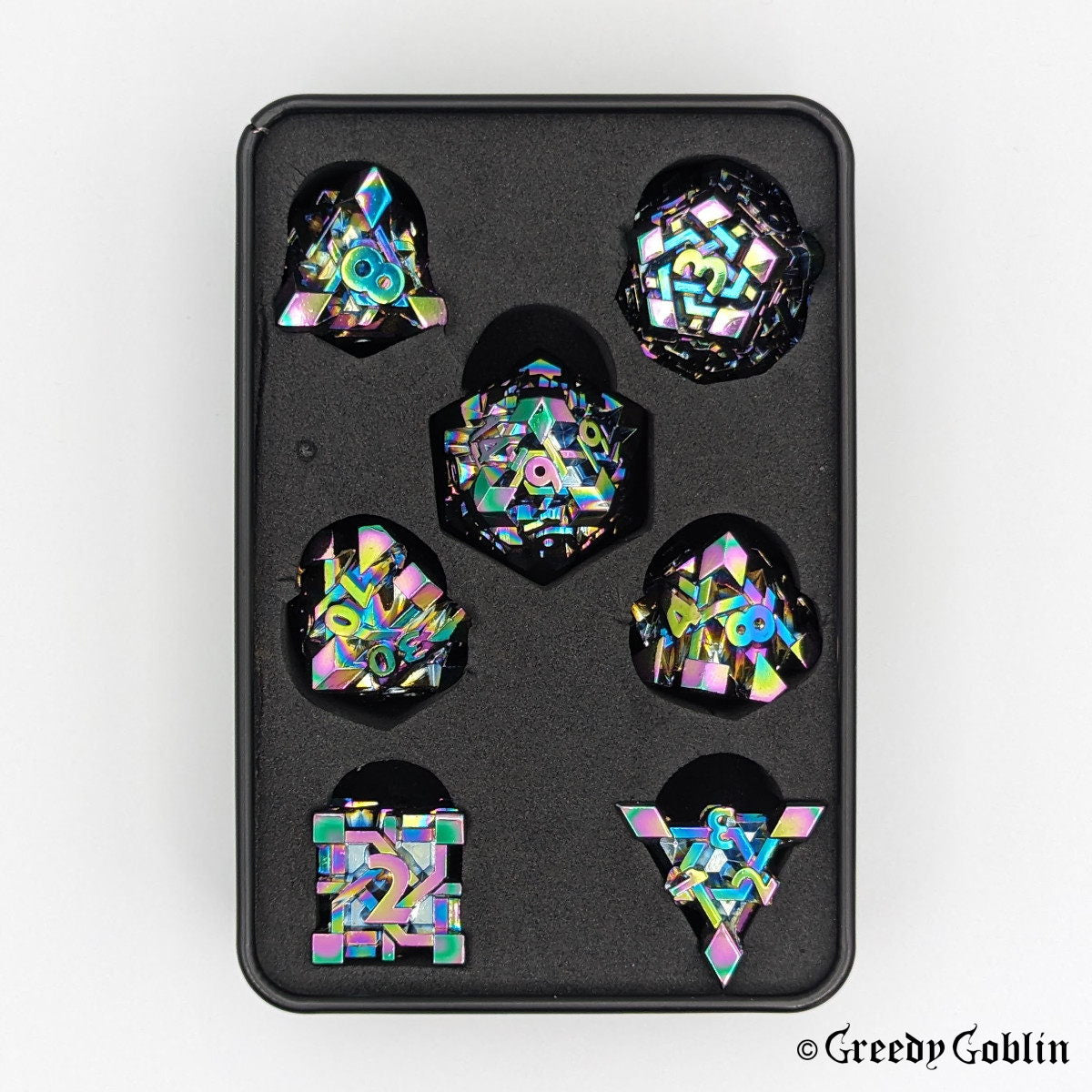 Metal Polydice set (D100, D8, D12, D10, D6, D20, D4) with oil slick finish, in a tin box.