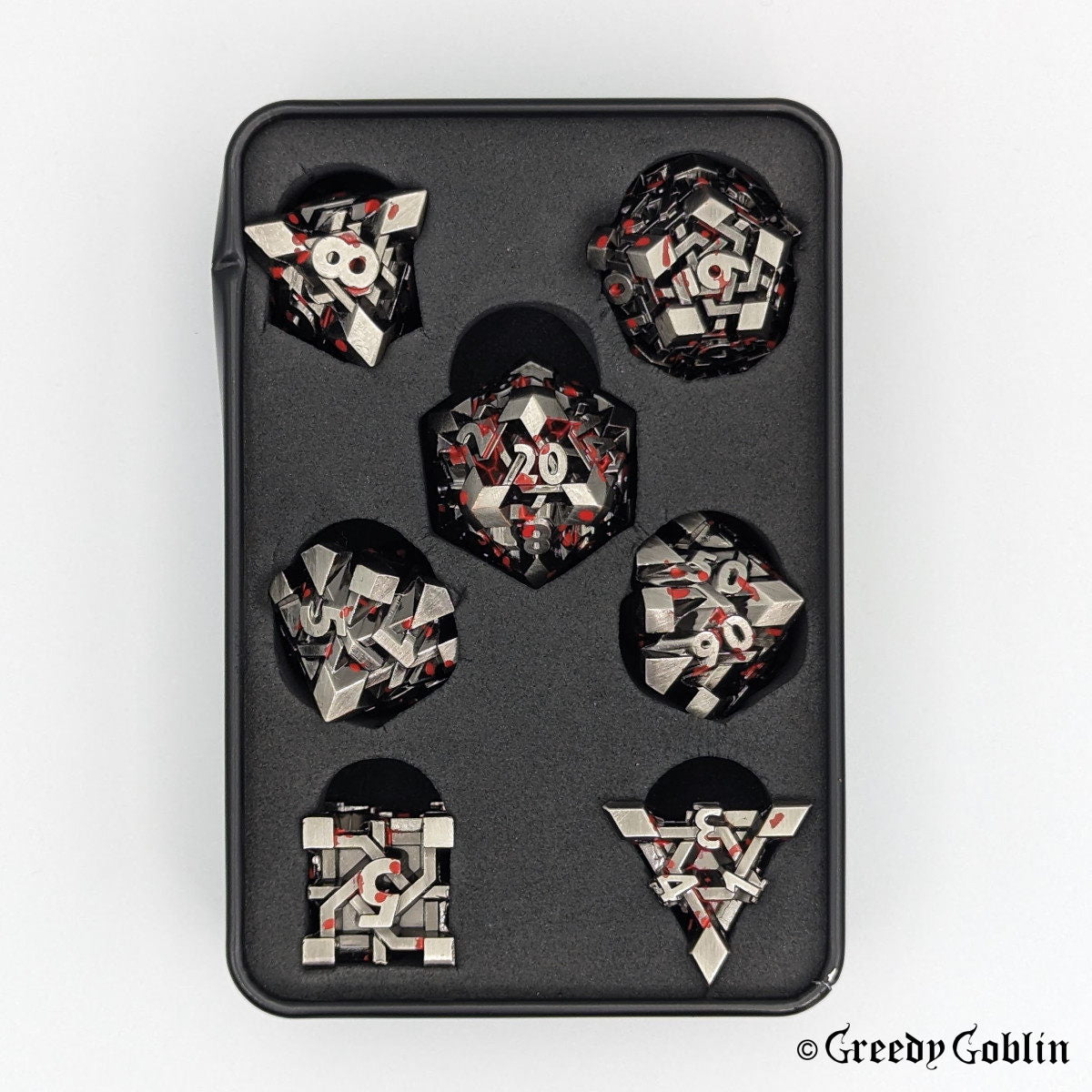Dwarven Runestone Polydice Set (D100, D8, D12, D10, D6, D20, D4) with metal finish and red splatters, in a tin box.