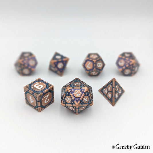 A set of seven DnD metal dice with copper color. Each die has purple-blue mica and white numbers. The dice are displayed on a white background.