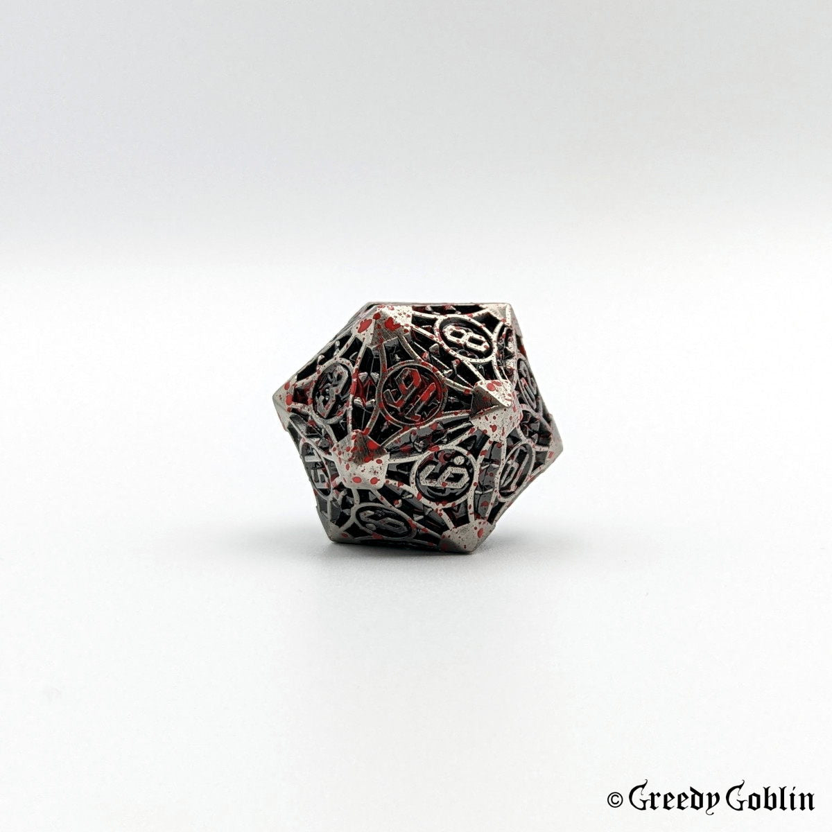 Metal grey D20 with red splatters from Polydice set.