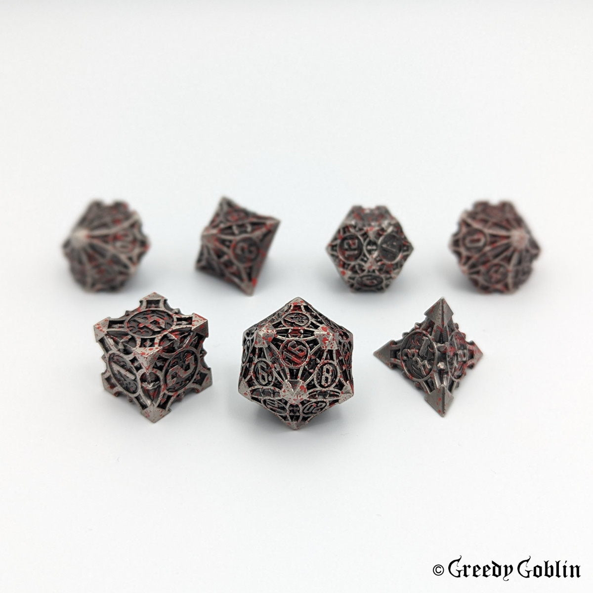 Metal grey Polydice set (D100, D8, D12, D10, D6, D20, D4) with red splatters.