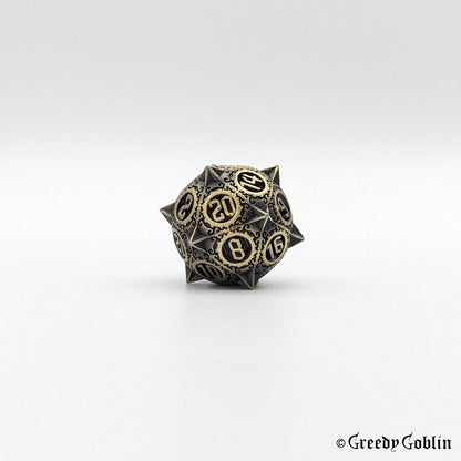 Metal D20 from DnD dice set with sharp edges and bronze finish.