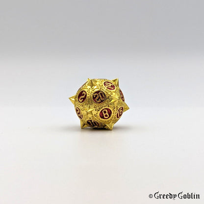 Metal D20 from DnD dice set with sharp edges and gold finish. The engravings behind the numbers are red.