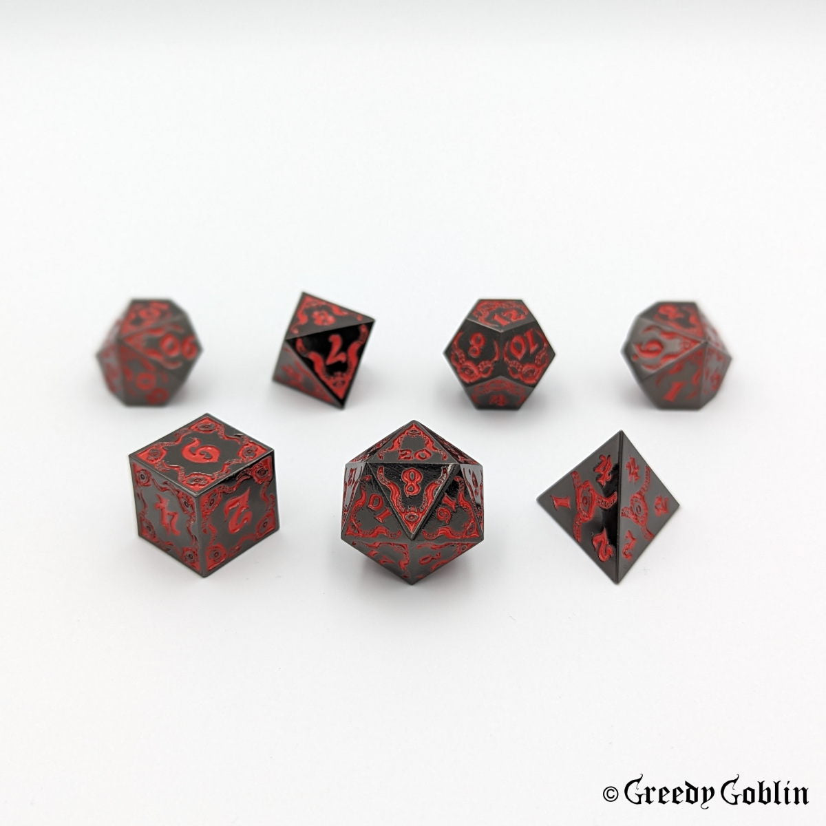 Cthulhu-themed DnD dice set in gunmetal with red engravings and numbers (D4, D6, D8, D12, D20, 2x D10).