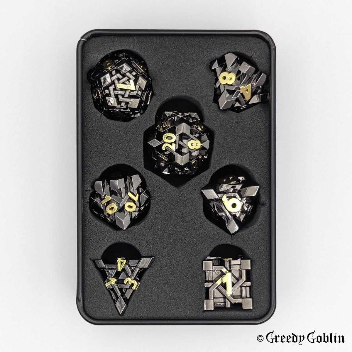 Dwarven Runestone Polydice Set (D100, D8, D12, D10, D6, D20, D4) with black finish and gold numbers, in a tin box. 