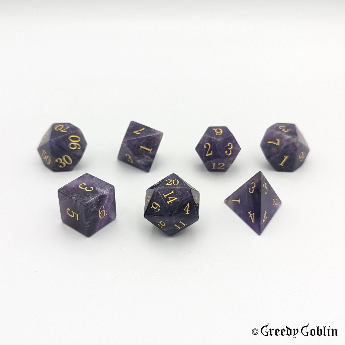 Amethyst gemstone Polydice set (D100, D8, D12, D10, D6, D20, D4) with gold numbers.